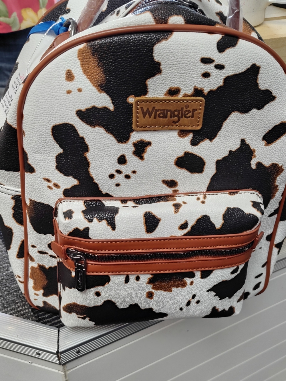 Wrangler Cowprint Mini Backpack in White, Black & Brown